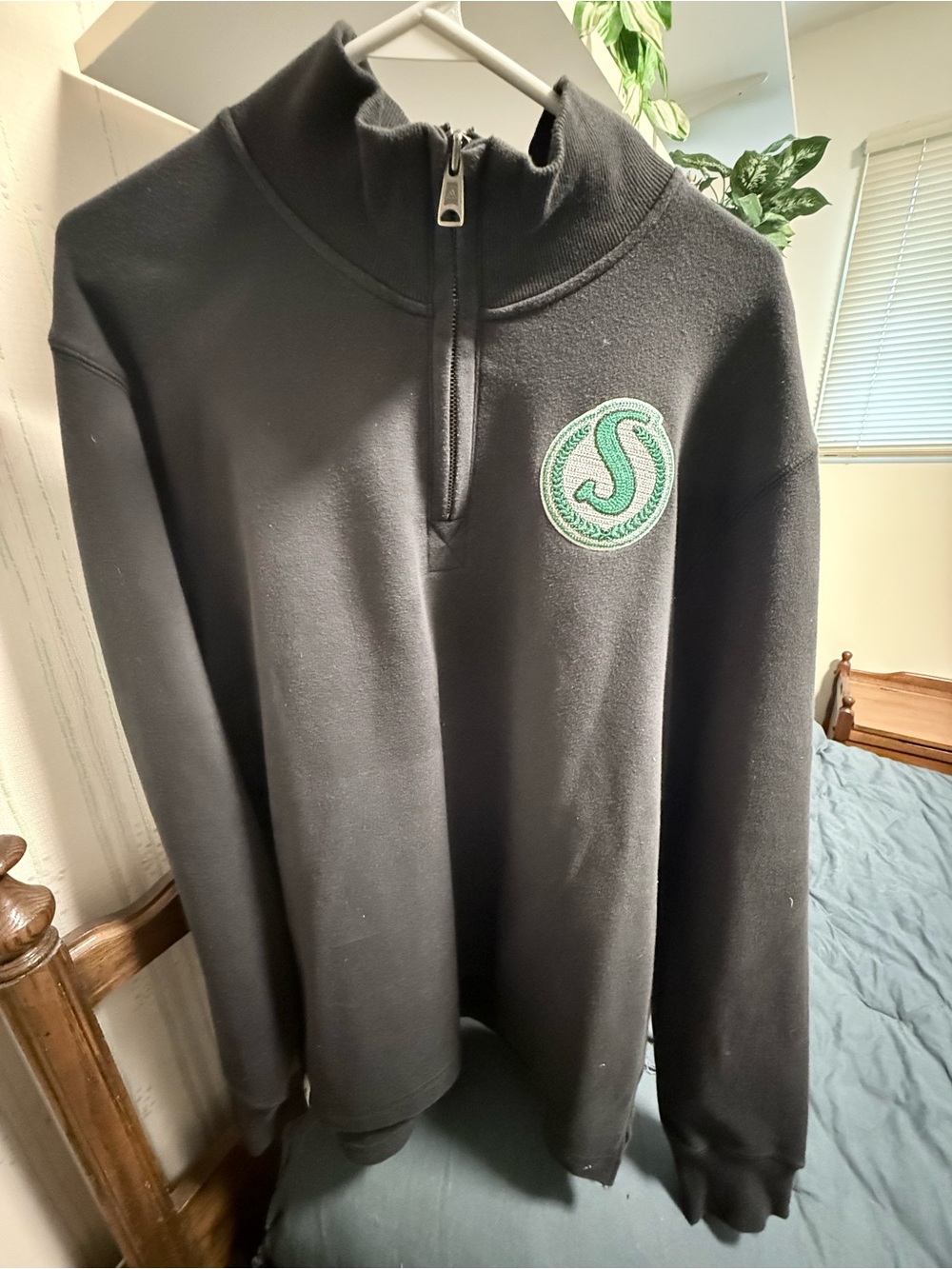 Men's Black Quarter-Zip Sweater with Sask Roughrider embroiders green Crest